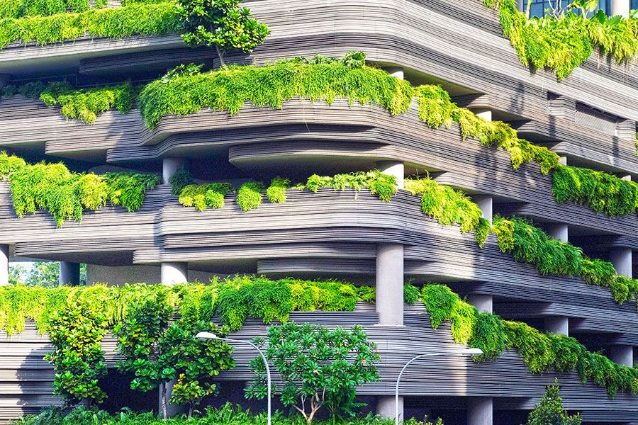 Urban Greenery Architecture Multi-story building with wavy balconies covered in green foliage, modern design integration.