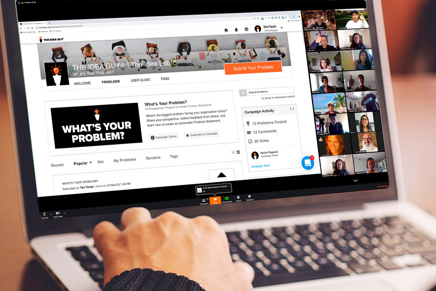 Office Team Collaboration Office scene with people conversing, using a phone, and examining a corkboard with sticky notes.